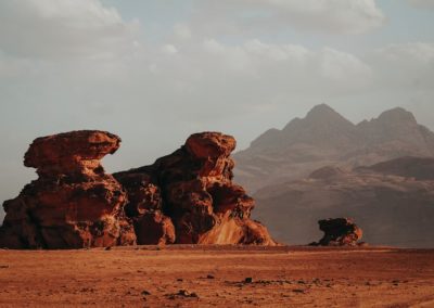 brown rock formation under white sky during daytime